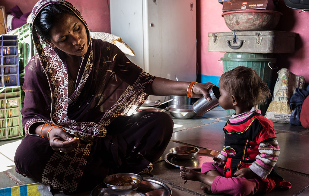 Bhumika safely back at home with her mother, Sunita feeding her the right food to keep her healthy