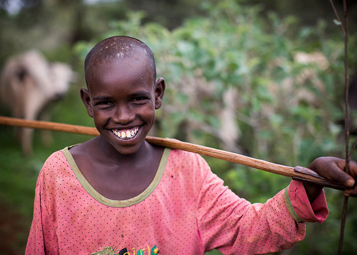 Young farmer smiling to camera in Ethiopia