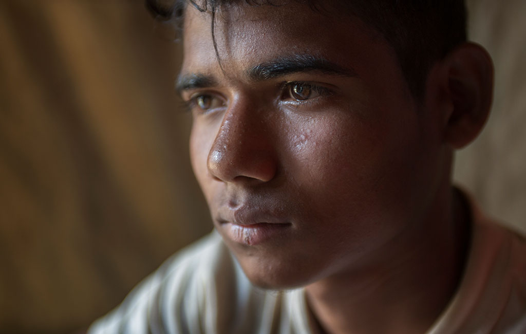 17 year old Mohammed Riaz , among young men and adolescents at a men's stress management session in the Balukali camp