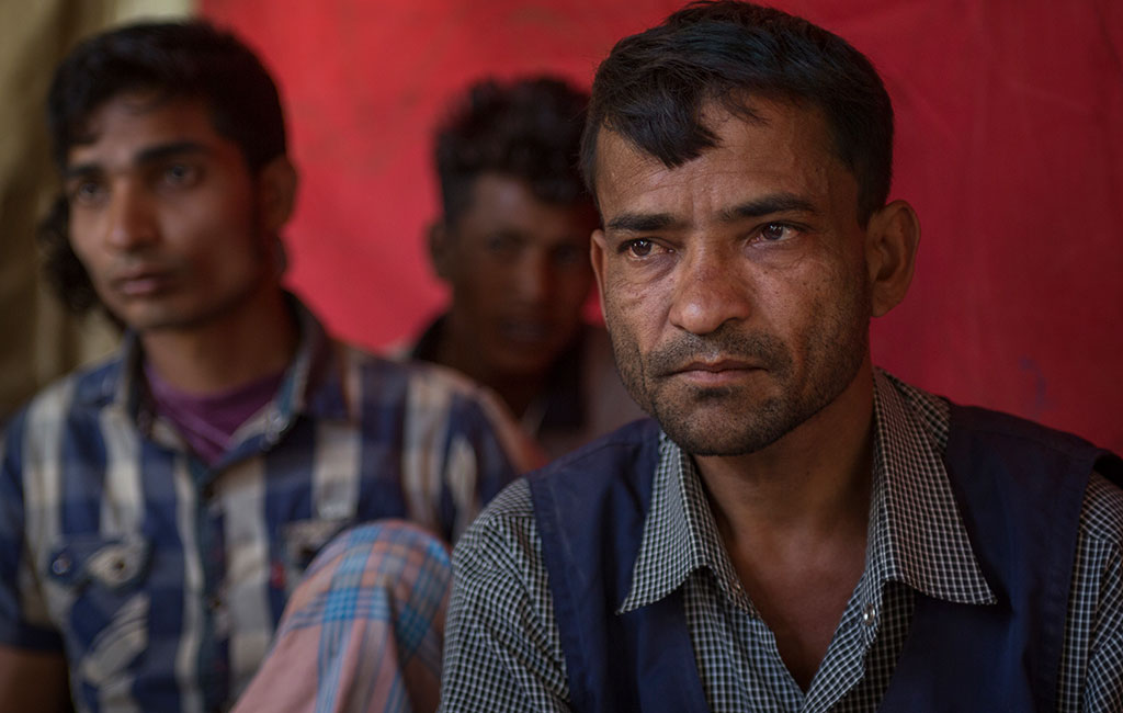 40 year old Mohammed Tayob among young men and adolescents at a men's stress management session in the Balukali camp