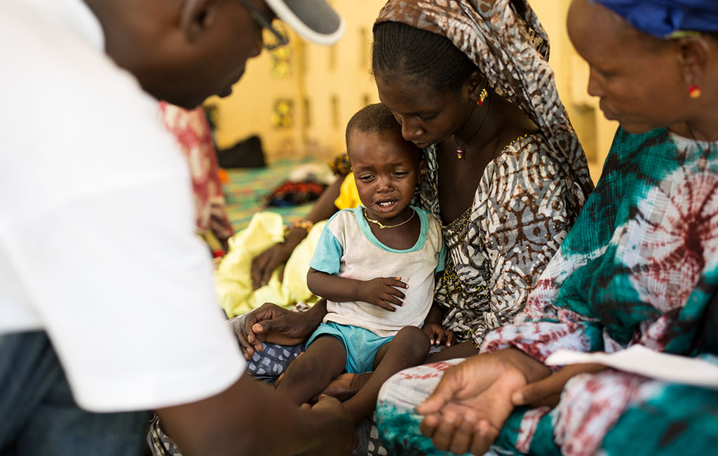 Ousmane receiving treatment through an Action Against Hunger programme
