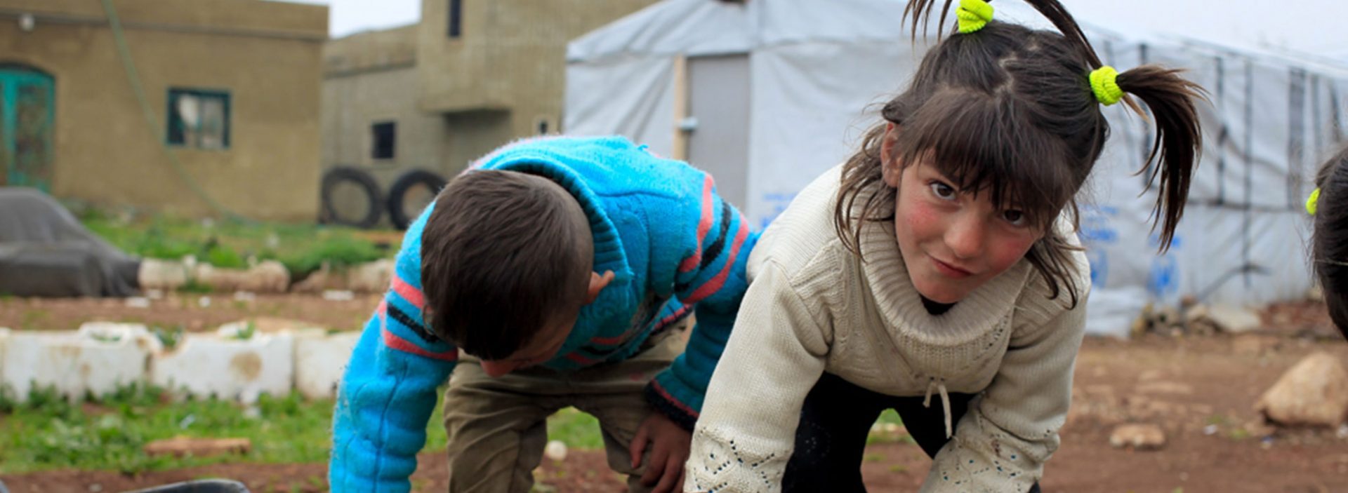 Syrian refugees planting seeds