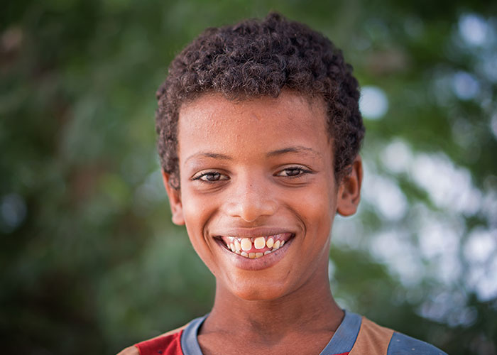 Ali next to the mobile clinic in his village in Abyan province, Yemen.