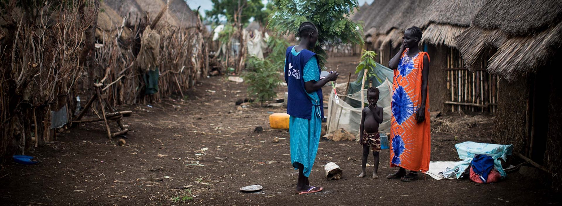 Refugees being supported by an Action Against Hunger staff member in Ethiopia.