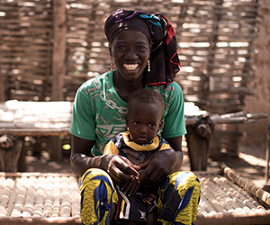A woman and her child in Mali. They've been supported by Action Against Hunger's community health workers.