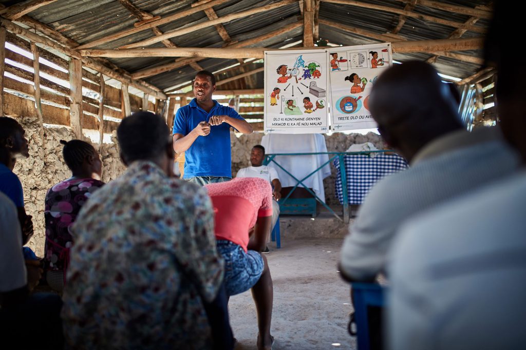 Trazilio, an Action Against Hunger chemist and lab technician, hosts an awareness raising session about cholera.