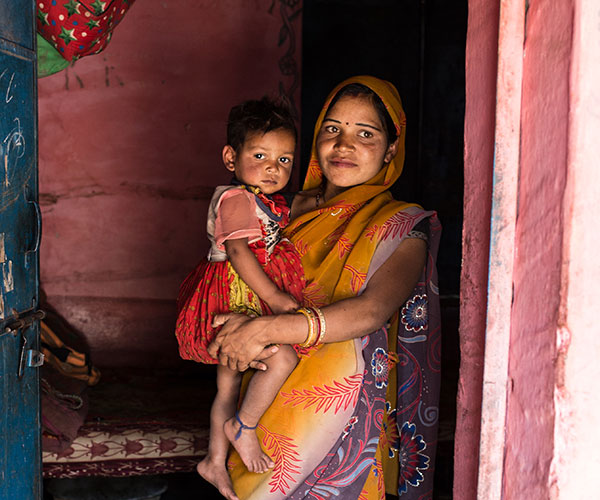 A mum and their son at an Action Against Hunger project in Baran, India.