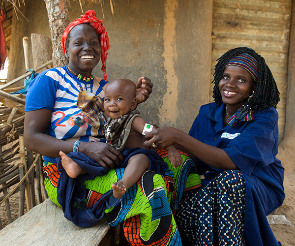 An Action Against Hunger staff member screens a child for malnutrition in Mali.