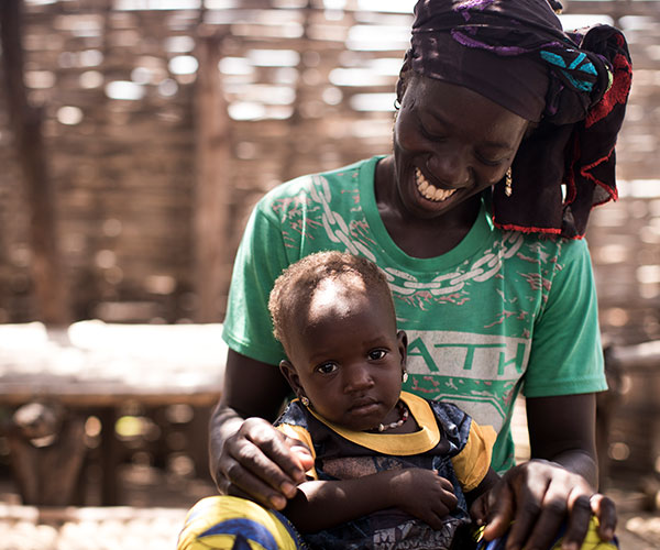 A woman and her child in Mali. They've been supported by Action Against Hunger's community health workers.