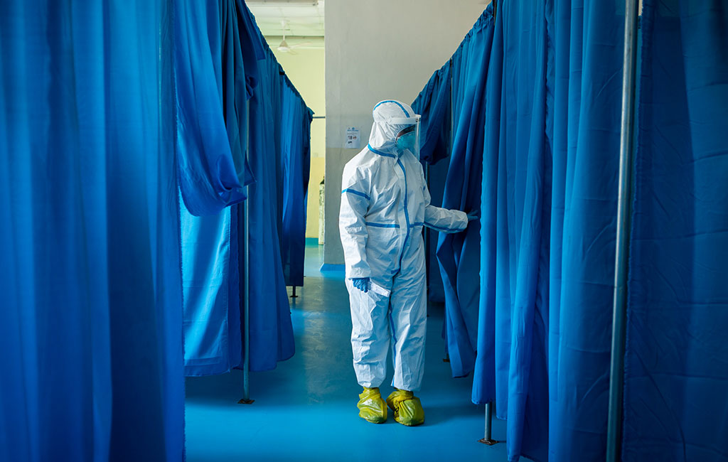 Action Against Hunger staff members checks up on a patient at coronavirus quarantine hospital in Mogadishu, Somalia.