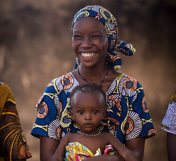 A smiling mother and her child in Mali.