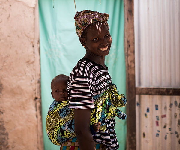 Simbo and his mum in Mali. Simbo recovered from life-threatening hunger after receiving support from Action Against Hunger.