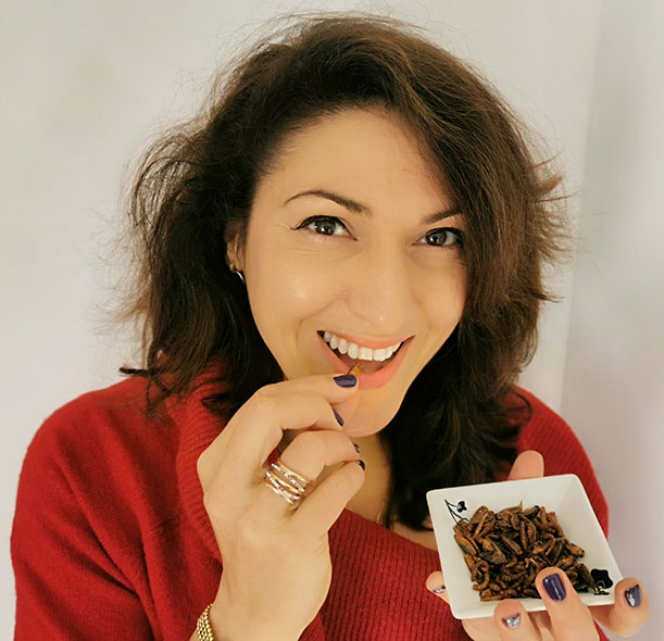Alexandra Rutishauser-Perera, Action Against Hunger's Head of Nutrition, eating mealworms and crickets.