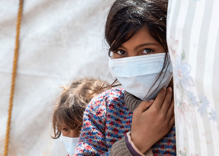 Bushra from Yemen wears a mask provided by Islamic Relief.