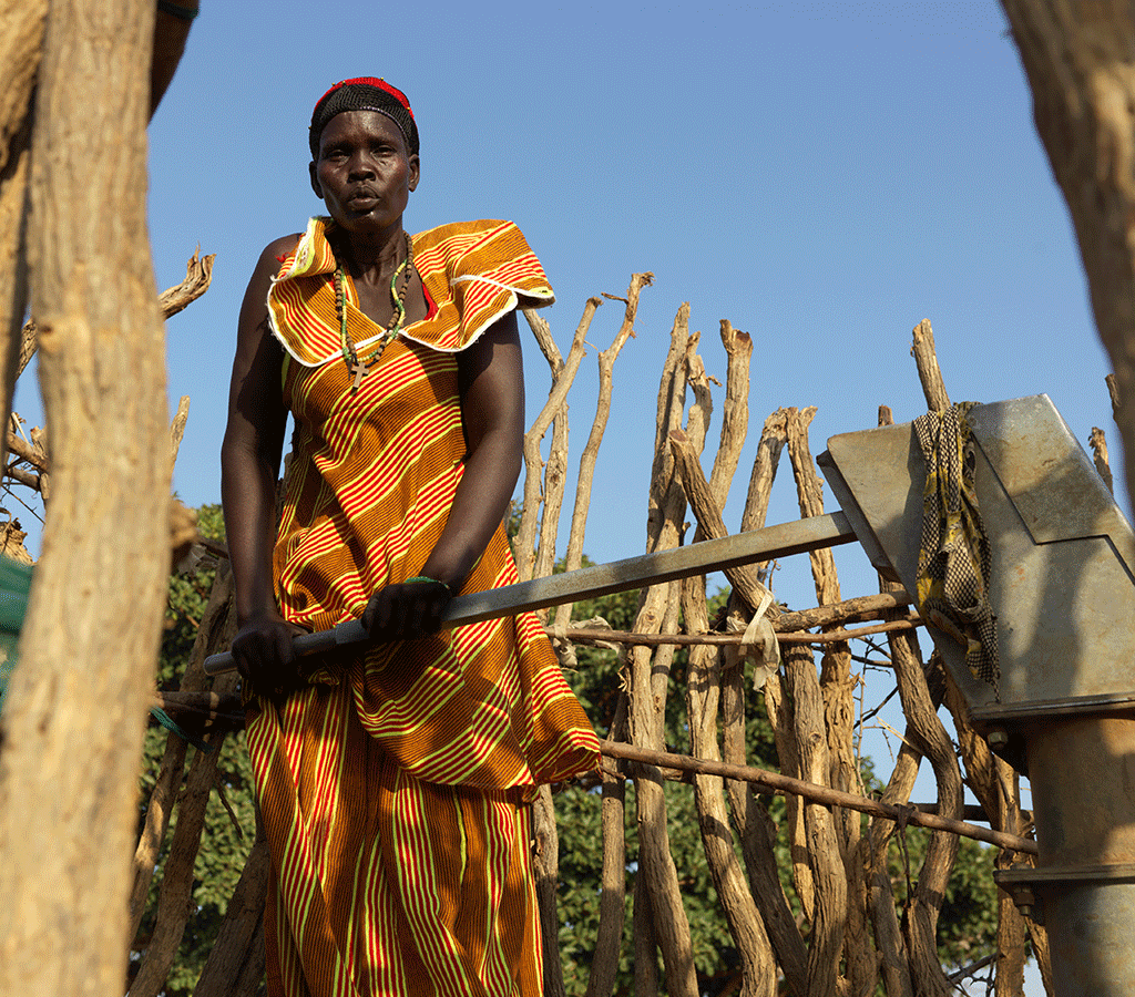 Nyanut collecting water at Baackuel Village, Malualkon, South Sudan.