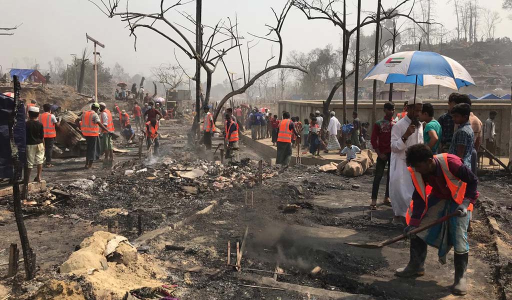 Action Against Hunger staff members help communities affected by the fires at a Rohingya refugee camp in Cox's Bazar, Bangladesh.