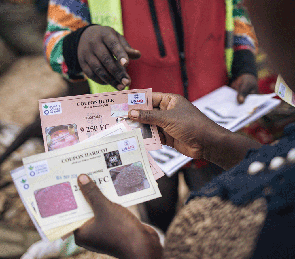 Cécile Tabo Mapamadjo receives food vouchers to use at food fairs in DRC