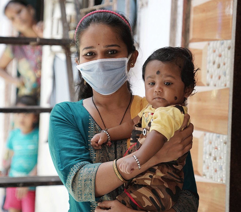 Ashwini Salvi with her young child in India 