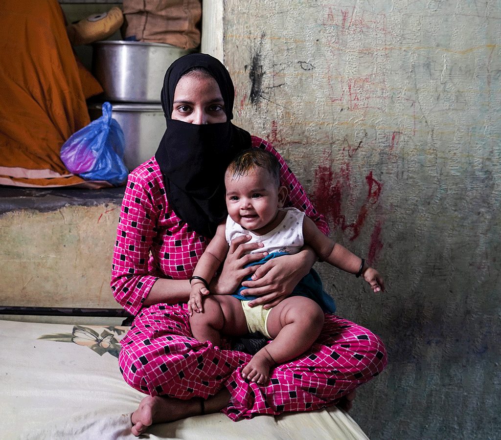 25-year-old Asma Sayyed with her youngest baby in India