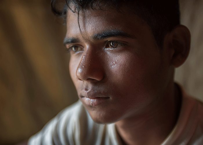 17 year old Mohammed Riaz , among young men and adolescents at a men's stress management session in the Balukali camp