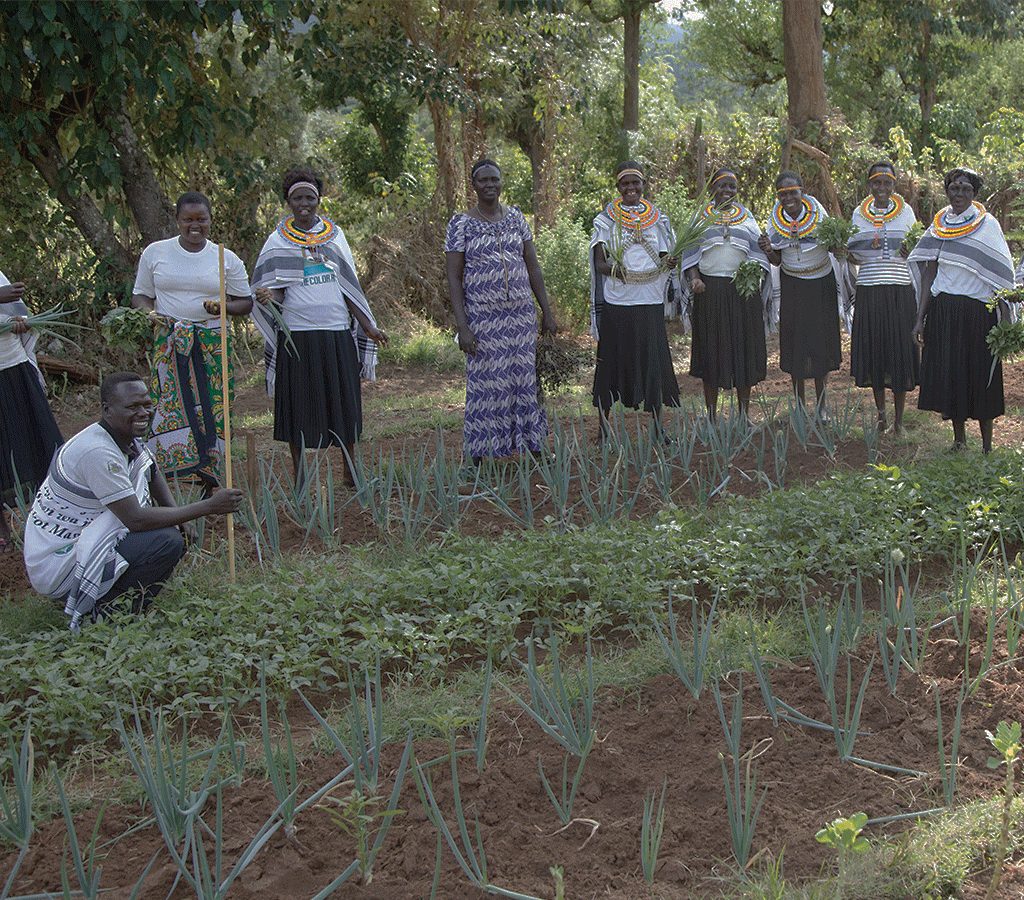 Women in the mother-to-mother support group in Kenya learn how to grow vegetables and farm food