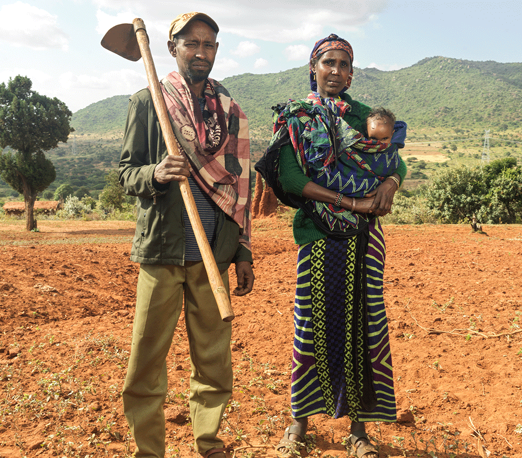 Kebele and her husband try to sow their dry land in Ethiopia although without rain crops often fail.