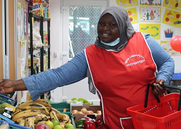 Volunteer at a community store run by Evelyn Community Store and Action Against Hunger partner Lewisham Homes