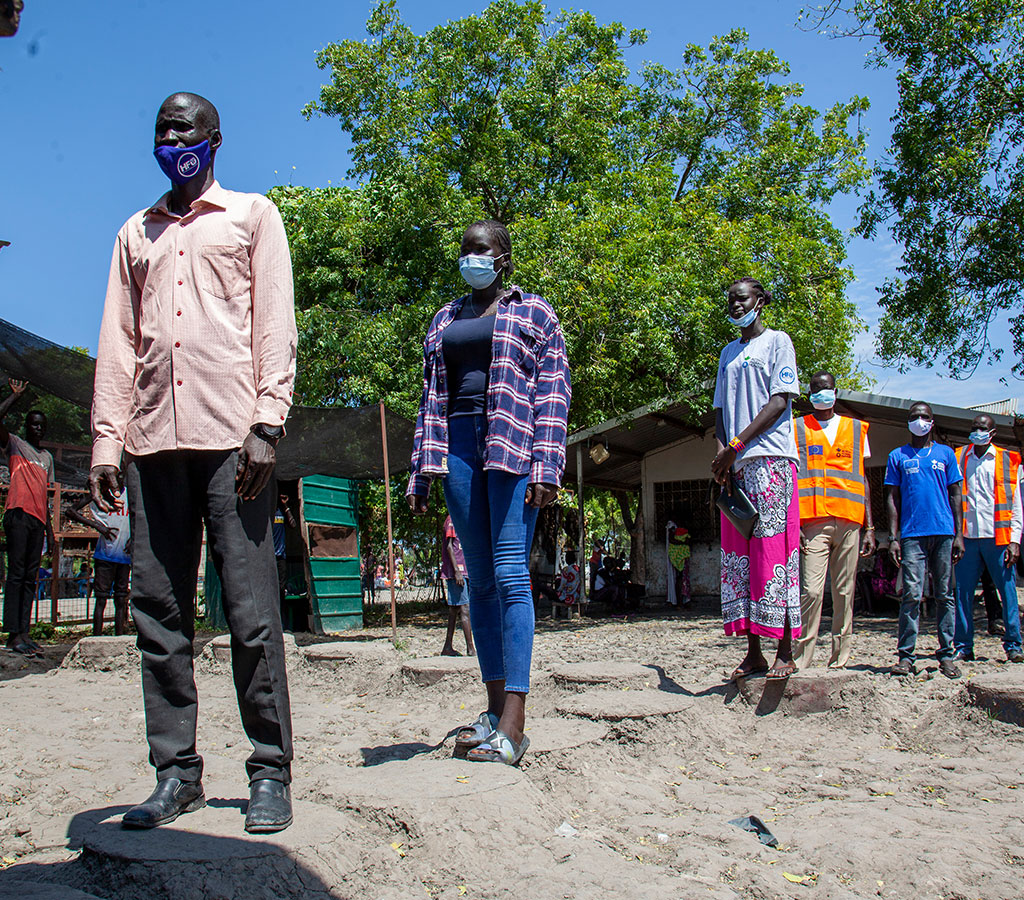 People in South Sudan wait in lines to receive their Covid-19 vaccine