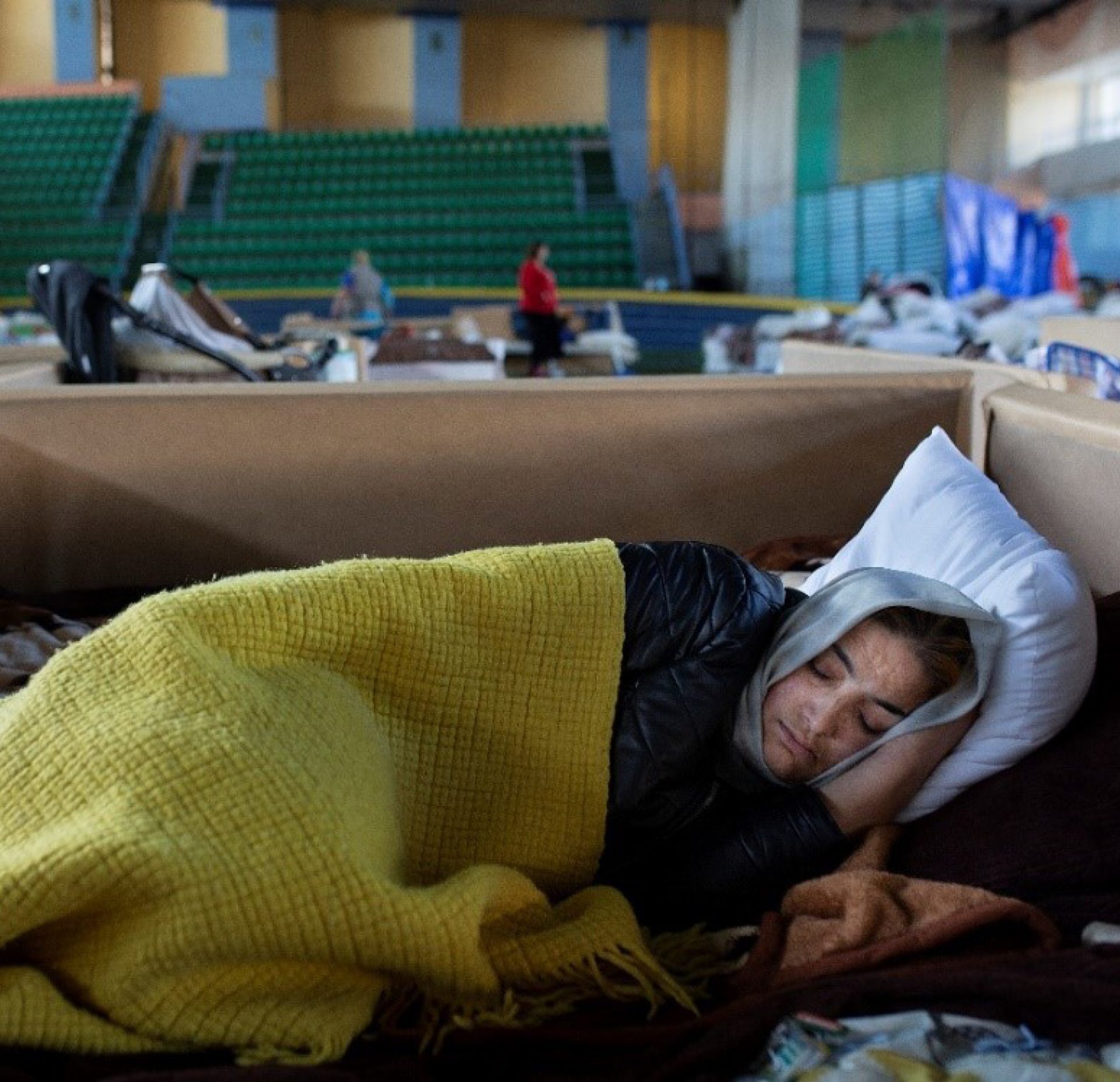 A Ukrainian refugee sleeps in a centre in Moldova