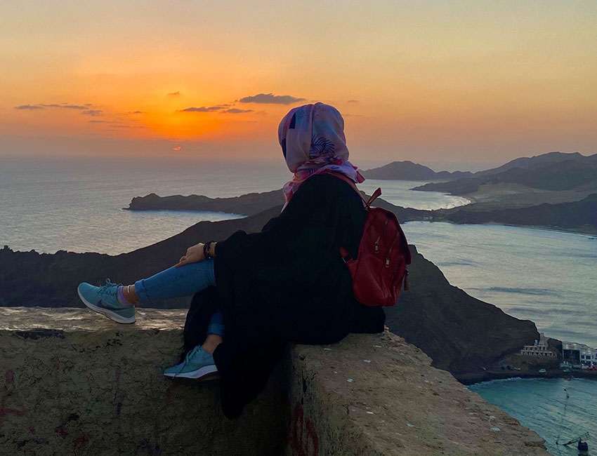 Nada, Action Against Hunger's Communication Officer in Yemen, looks out onto the ocean.
