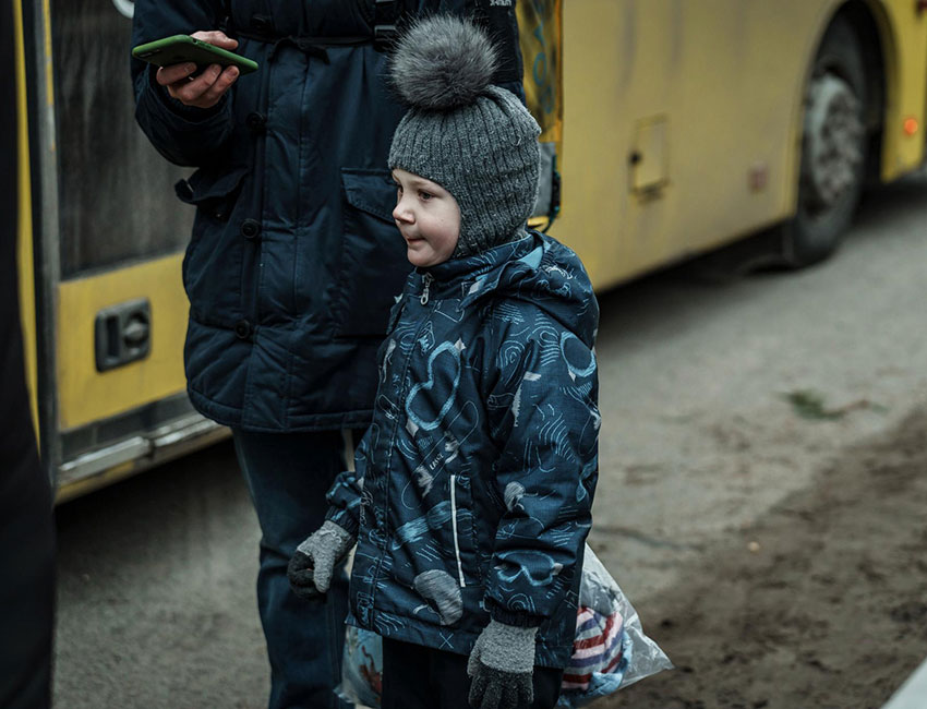 A boy fleeing conflict in Ukraine.