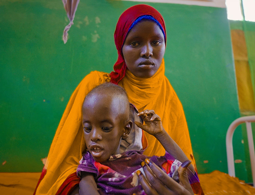 Nimco and Abdirahman at an Action Against Hunger treatment centre in Mogadishu, Somalia.