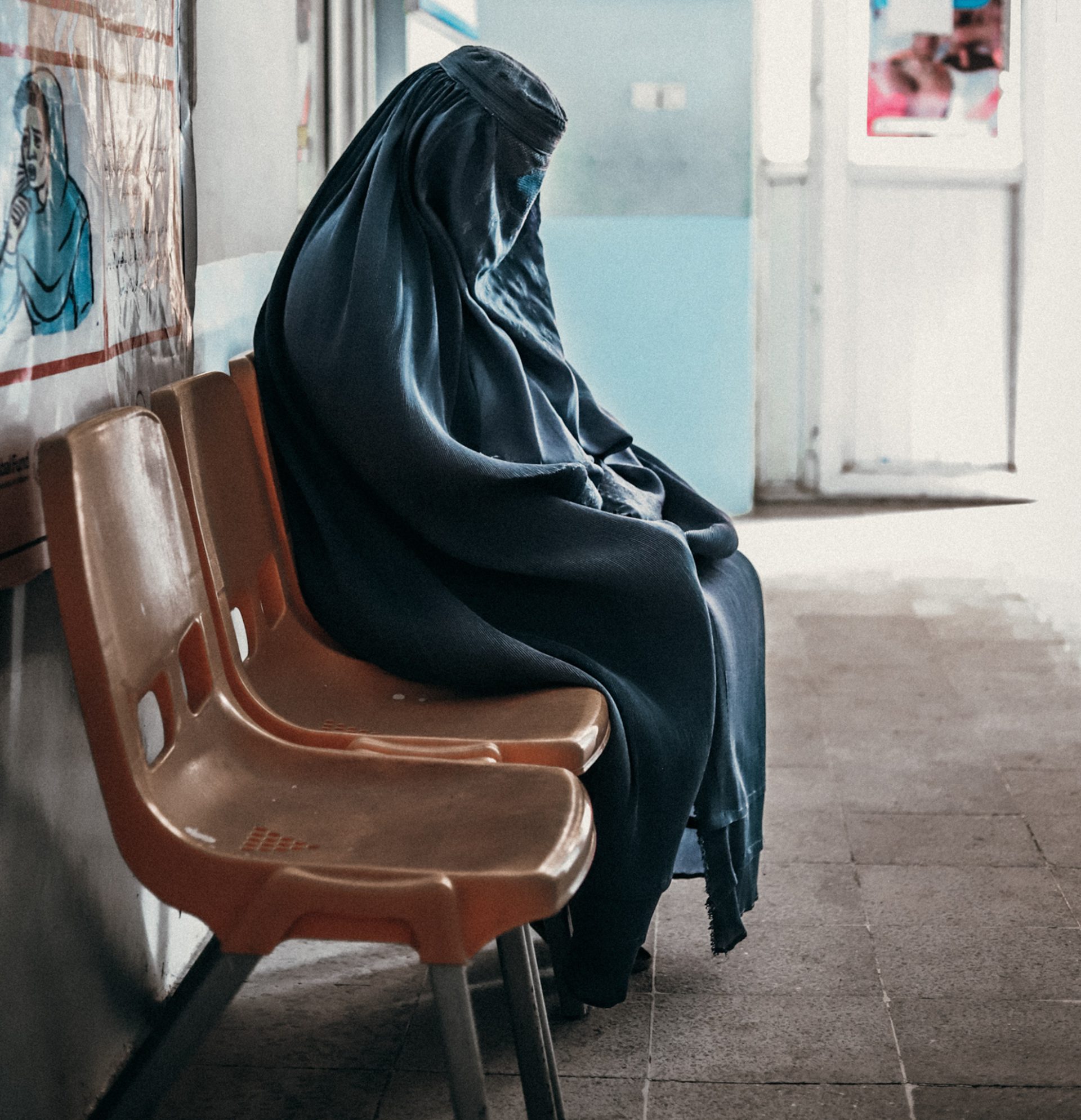 A mother in the waiting room of the Jabalseraj Action Against Hunger clinic in Parwan province, Afghanistan