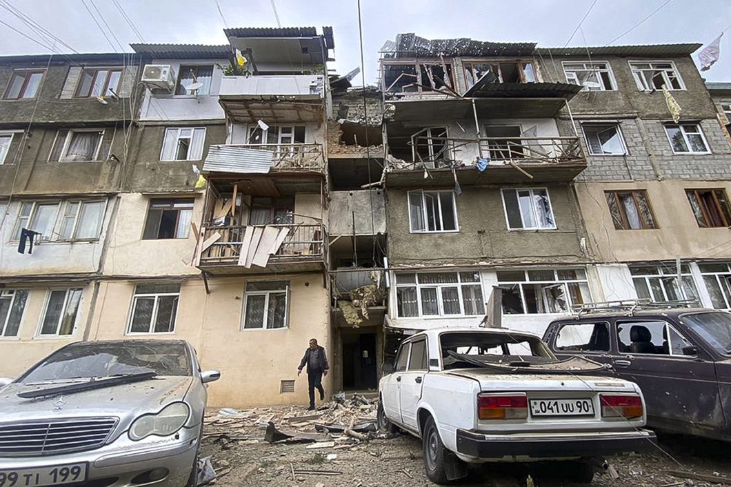 A damaged residential apartment building following shelling is seen in Stepanakert, Nagorno-Karabakh. Azerbaijan on Tuesday, Sept. 19, 2023, declared that it started what it called an 