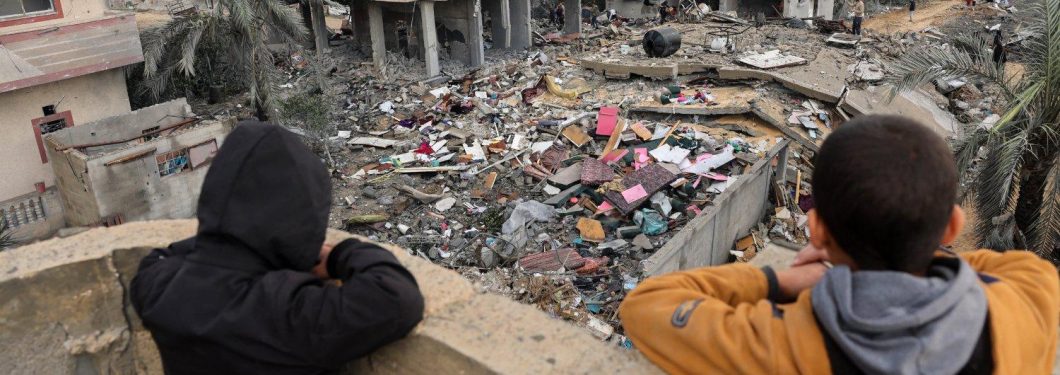 Palestinian children look at the rubble of a building destroyed during Israeli attacks in Rafah, southern Gaza Strip, last November © Mohammed Abed / AFP