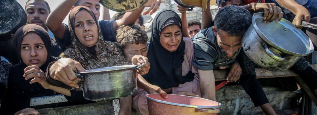 Palestinians waiting for food aid in Gaza.