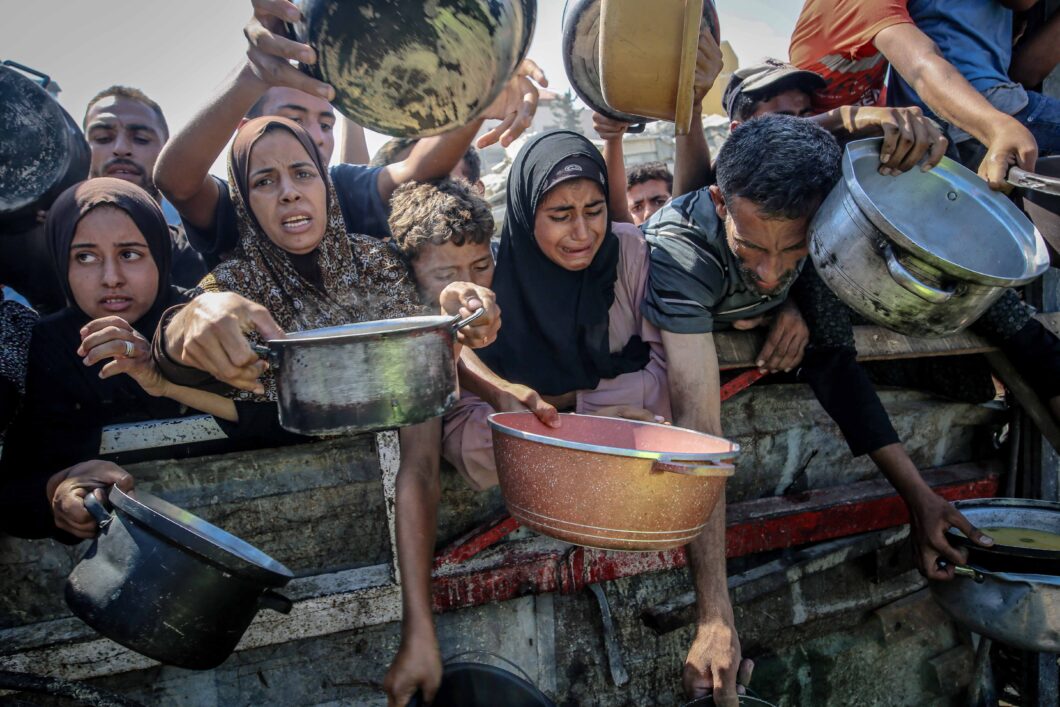 Palestinians waiting for food aid in Gaza.