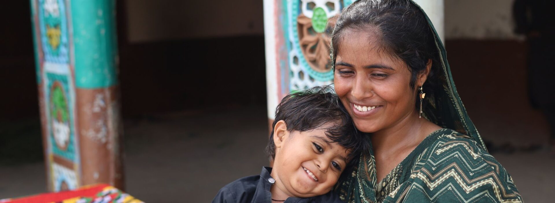 Seema from Pakistan with her son. Action Against Hunger helped them to gain access to clean water.
