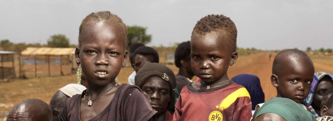 Child refugees on a vehicle fleeing Sudan