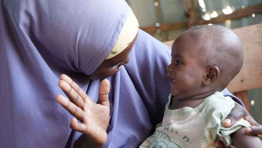 A child with their mother, recovering from malnutrition at one of Action Against Hunger's treatment programmes.
