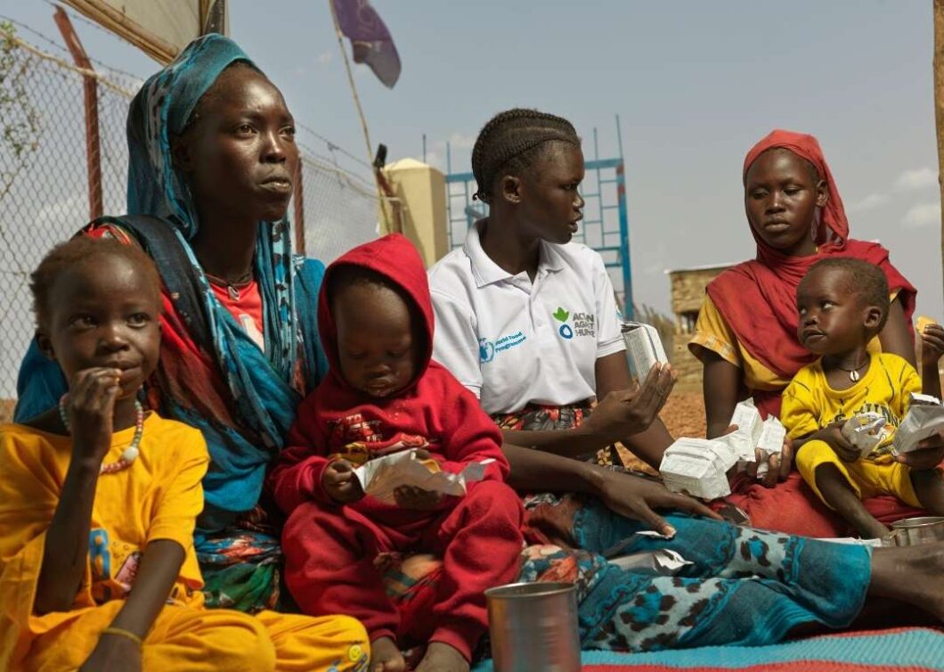 An Action Against Hunger worker with refugees