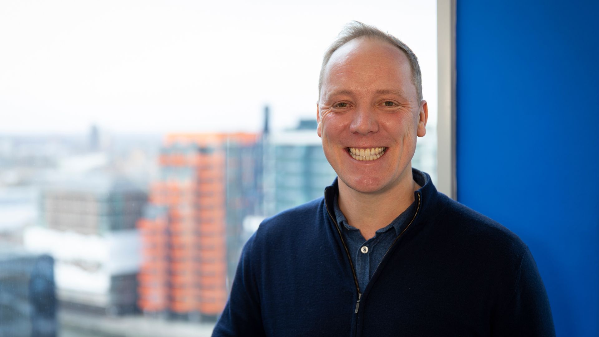 Portrait of Will Morgan-Macleod, Director of Fundraising and Communications at Action Against Hunger UK.