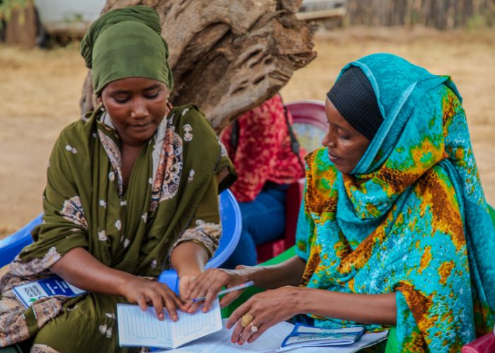Shinda takes part in women's group in Kenya.