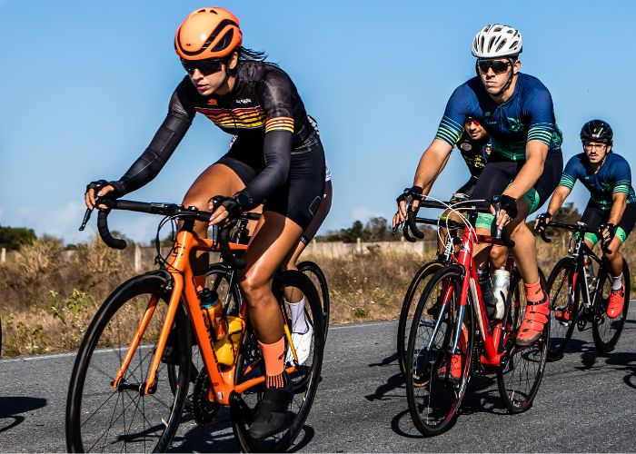 Cyclists riding on road in cycling event.